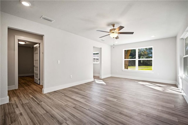 interior space with visible vents, dark wood finished floors, and baseboards