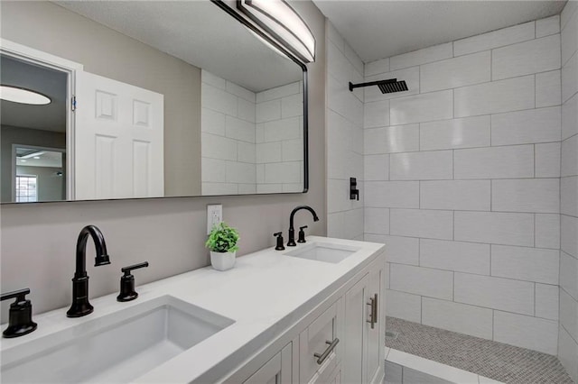 1112 Druid Dr, Mobile, AL 36618 - bathroom with a tile shower and double vanity