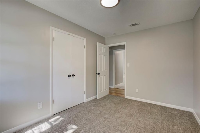 1112 Druid Dr, Mobile, AL 36618 - unfurnished bedroom with carpet flooring, baseboards, and a closet