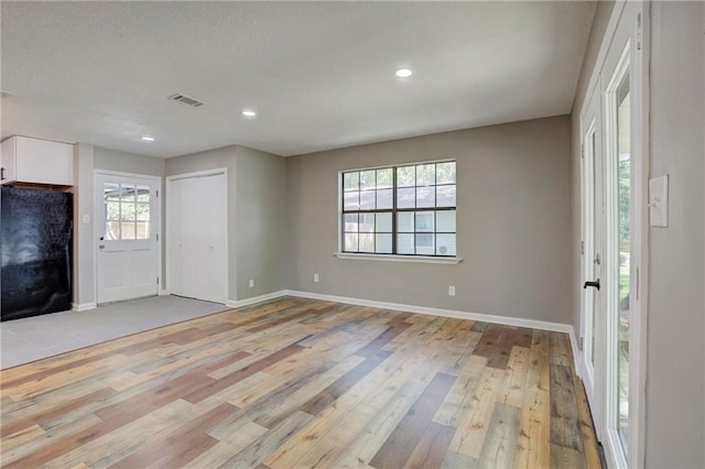 1112 Druid Dr, Mobile, AL 36618 - unfurnished living room featuring light wood-style floors, baseboards, and recessed lighting