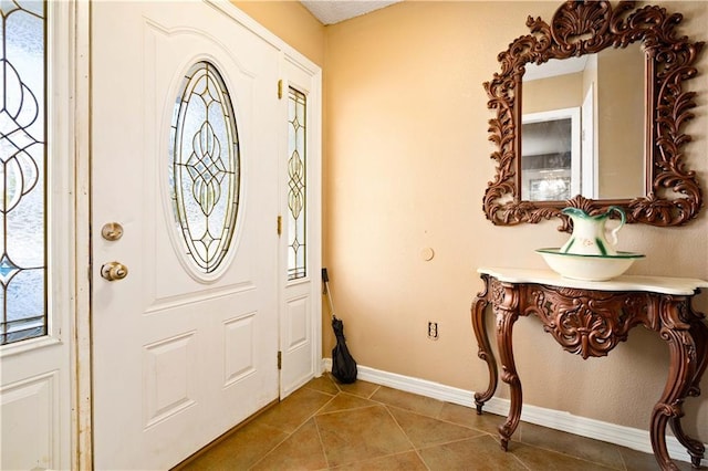 foyer with tile patterned floors