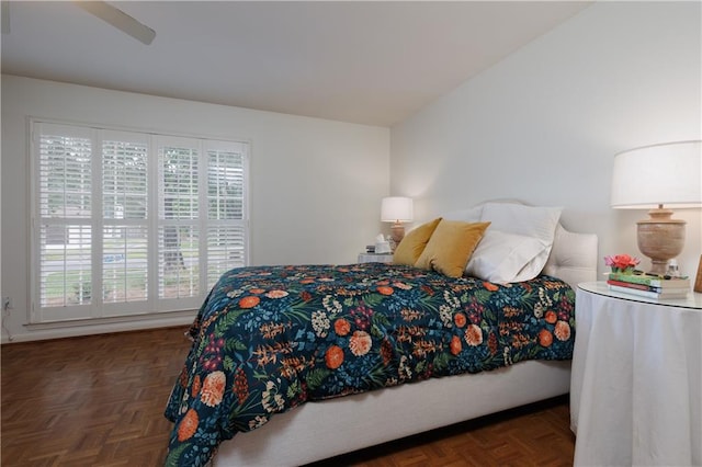 bedroom featuring dark parquet flooring and ceiling fan