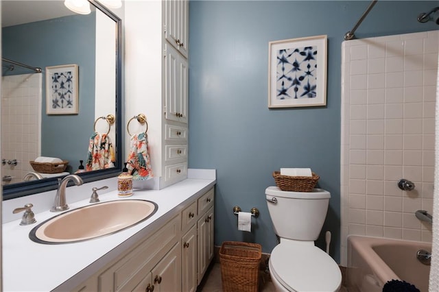 full bathroom with vanity, toilet, and tiled shower / bath combo