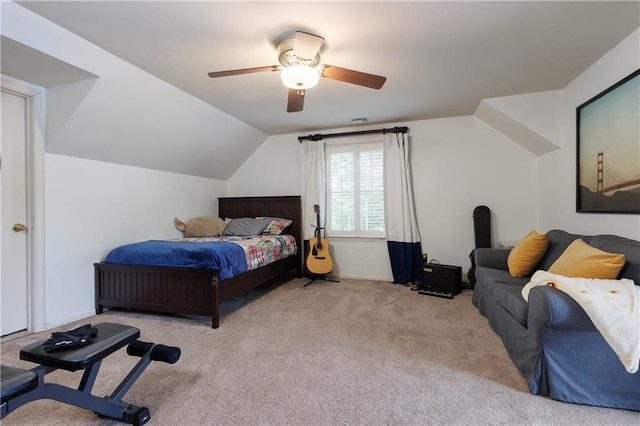 carpeted bedroom featuring ceiling fan and vaulted ceiling