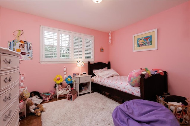 bedroom featuring parquet flooring