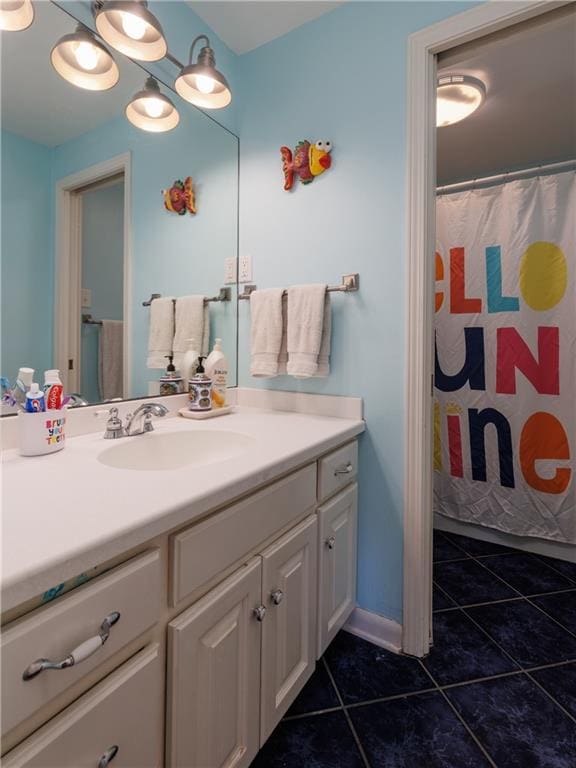 bathroom with tile patterned floors, vanity, and a shower with shower curtain