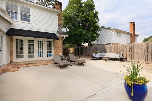 view of patio / terrace with french doors and an outdoor living space