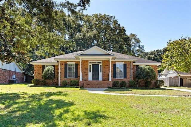 ranch-style house featuring a front yard