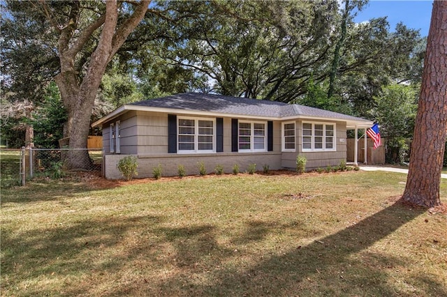 ranch-style house featuring a front lawn