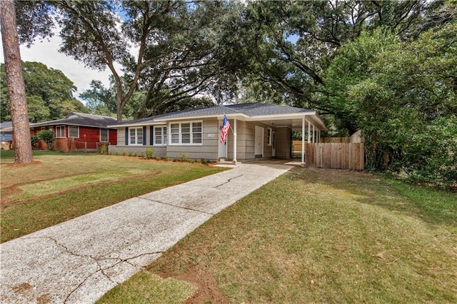 view of front facade featuring a front lawn and a carport