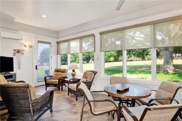 sunroom / solarium featuring a wall unit AC