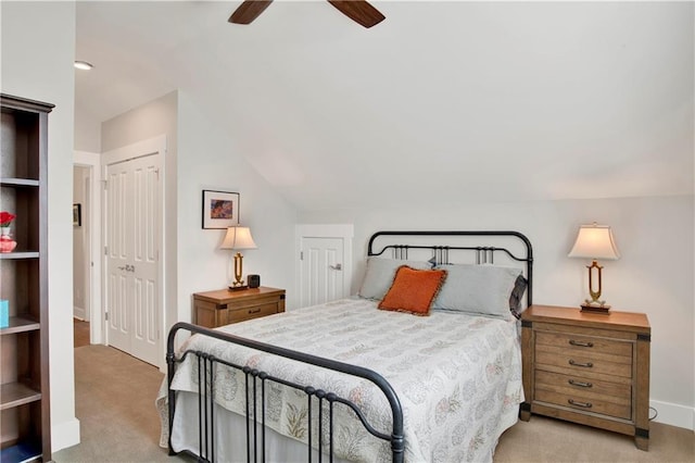 carpeted bedroom with ceiling fan and lofted ceiling