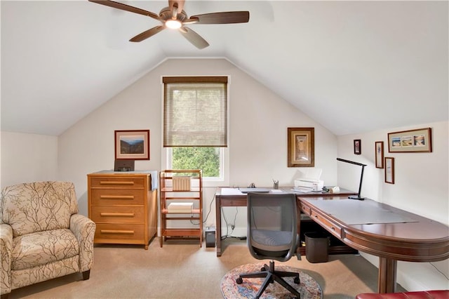 carpeted office space featuring vaulted ceiling and ceiling fan