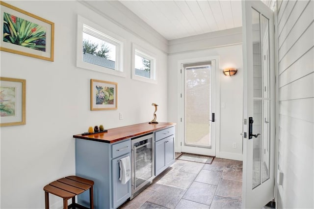 interior space featuring wooden ceiling and beverage cooler