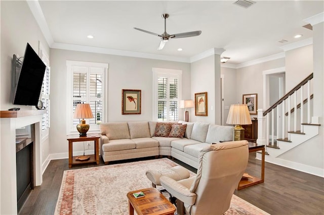 living room featuring crown molding, dark hardwood / wood-style flooring, and ceiling fan