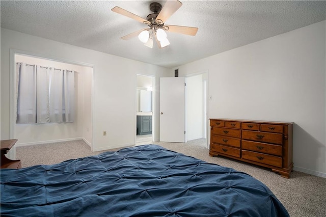 bedroom with visible vents, baseboards, ceiling fan, carpet, and a textured ceiling