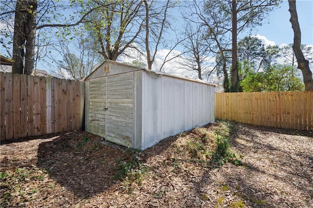 view of shed featuring a fenced backyard