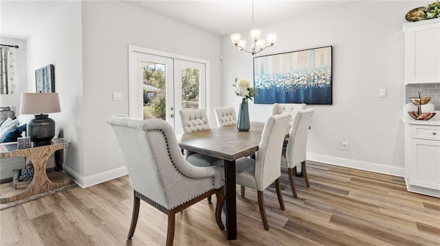 7320 Hawkins Mnr S, Mobile, AL 36695 - dining room featuring light wood-style flooring, a chandelier, and french doors