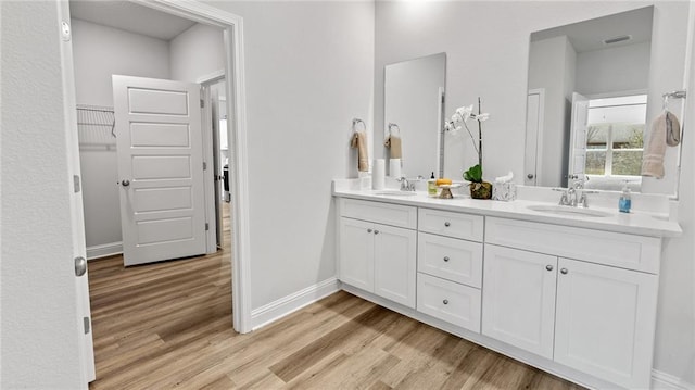 7320 Hawkins Mnr S, Mobile, AL 36695 - full bath featuring wood finished floors and double vanity