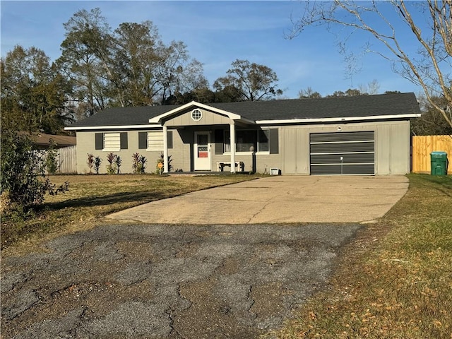 ranch-style house with a front yard and a garage