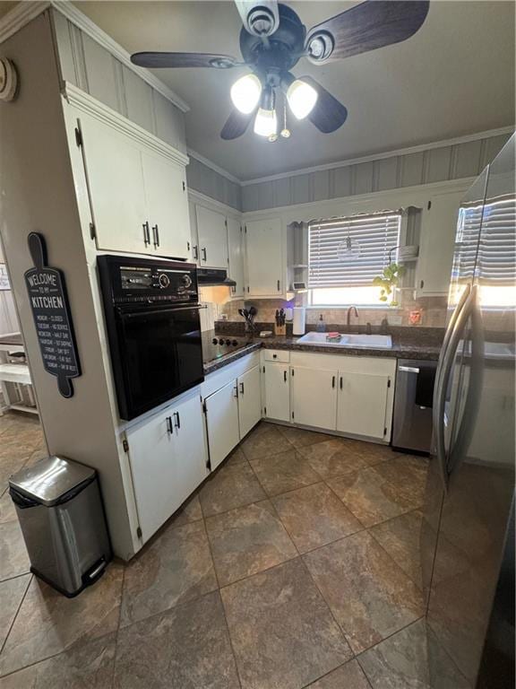 kitchen with black appliances, white cabinets, sink, ceiling fan, and ornamental molding