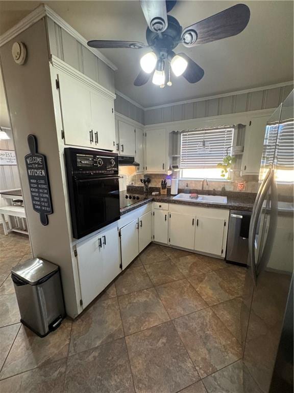 kitchen with ceiling fan, crown molding, sink, black appliances, and white cabinets