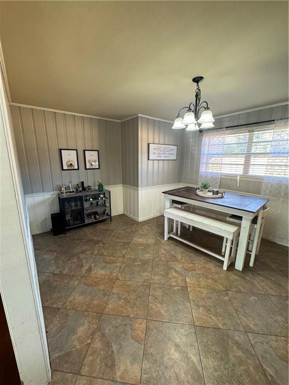 unfurnished dining area featuring a notable chandelier