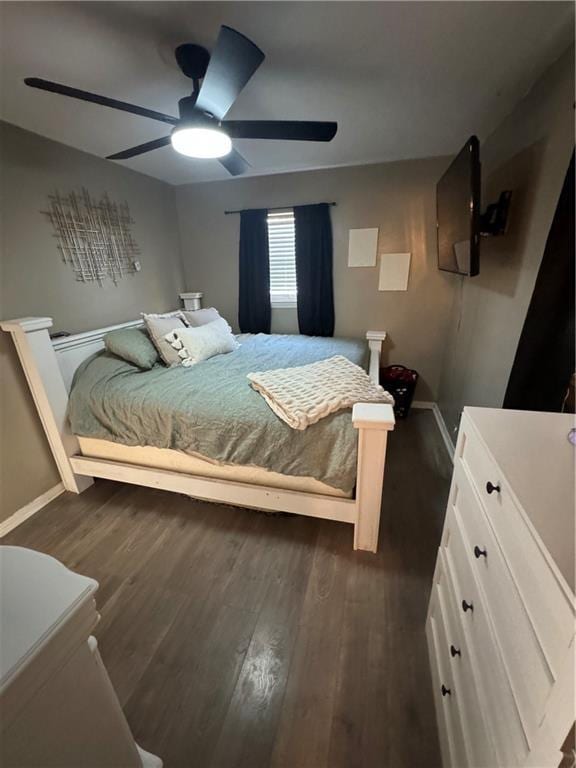 bedroom featuring ceiling fan and dark hardwood / wood-style flooring