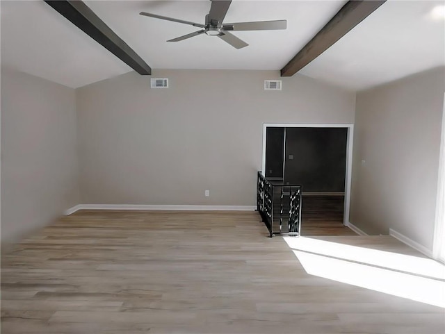 unfurnished living room with ceiling fan, light hardwood / wood-style flooring, and vaulted ceiling with beams