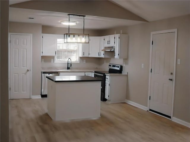 kitchen featuring stove, white cabinets, pendant lighting, and light hardwood / wood-style floors