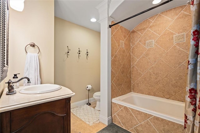 full bathroom featuring vanity, toilet, tile patterned floors, and shower / bath combo with shower curtain