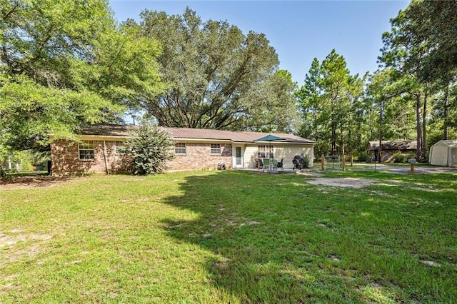 rear view of house with a lawn