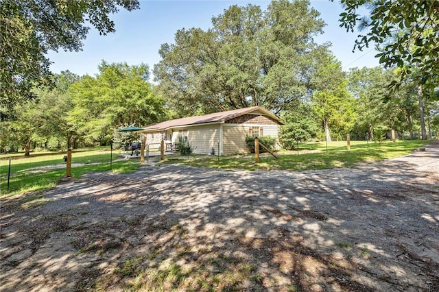 view of home's exterior with a yard