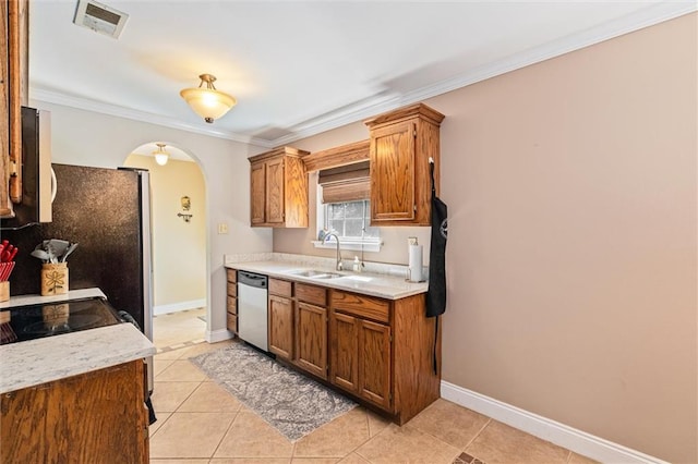 kitchen featuring sink, light tile patterned floors, ornamental molding, and dishwasher