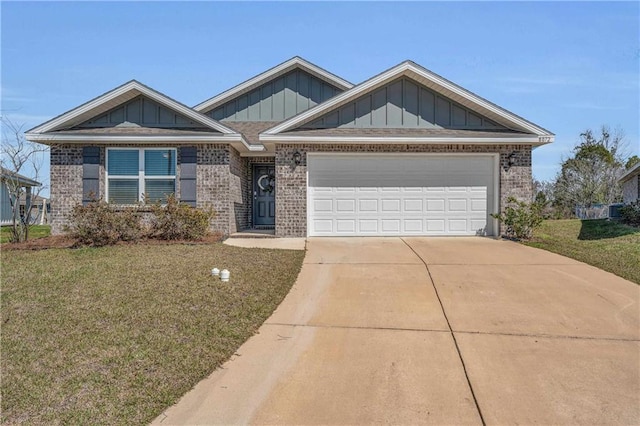 view of front of house with concrete driveway, brick siding, board and batten siding, and a front yard