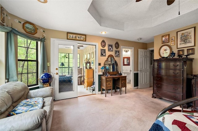 3425 Poe Rd S, Chunchula, AL 36521 - bedroom featuring light carpet, french doors, a textured ceiling, access to exterior, and a tray ceiling