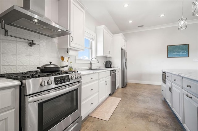 11531 Schmidt Ln S, Mobile, AL 36695 - kitchen with wall chimney range hood, stainless steel appliances, concrete flooring, tasteful backsplash, and white cabinets