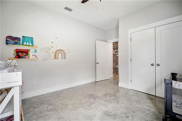 11531 Schmidt Ln S, Mobile, AL 36695 - bedroom with finished concrete floors, a closet, and ceiling fan