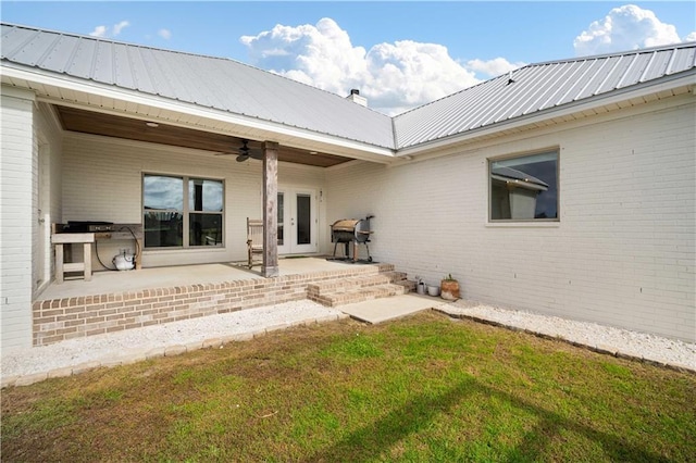 11531 Schmidt Ln S, Mobile, AL 36695 - rear view of property with ceiling fan, a patio, brick siding, a metal roof, and french doors