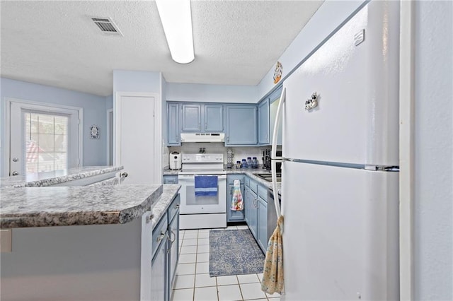 kitchen featuring white appliances, visible vents, light tile patterned flooring, light countertops, and under cabinet range hood