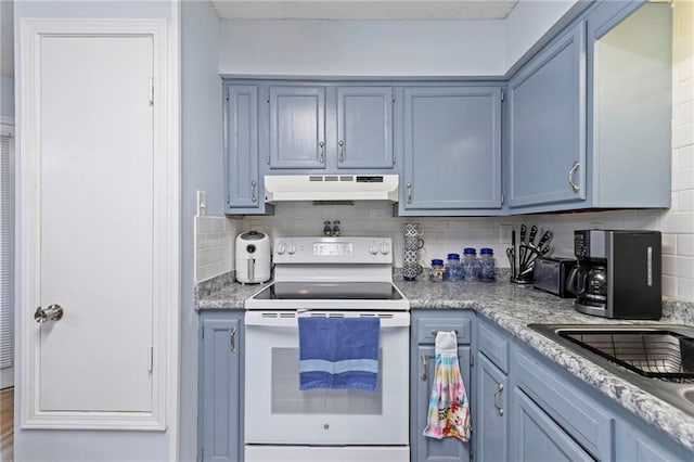 kitchen with under cabinet range hood, decorative backsplash, white electric stove, and blue cabinets