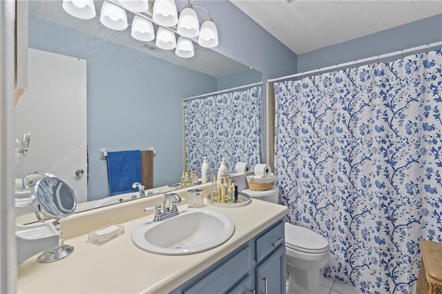 full bath with tile patterned floors, a shower with curtain, toilet, a textured ceiling, and vanity