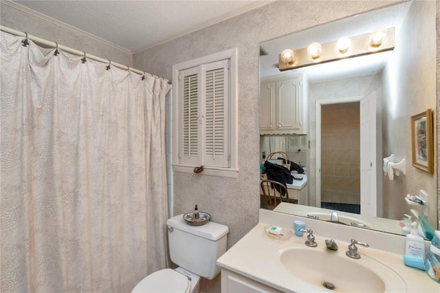 bathroom featuring crown molding, a textured ceiling, vanity, a textured wall, and toilet