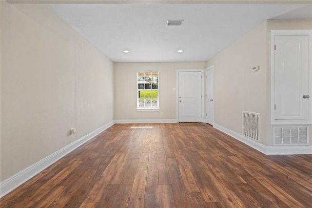 empty room featuring dark hardwood / wood-style flooring