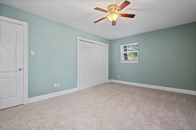 unfurnished bedroom with ceiling fan and carpet floors