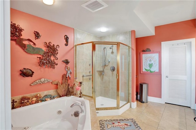 bathroom featuring separate shower and tub