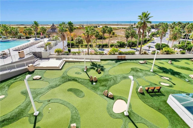 view of home's community with a water view and a swimming pool