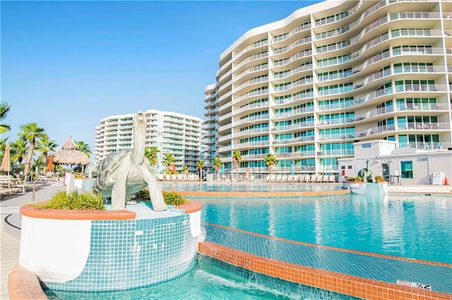 view of swimming pool featuring pool water feature