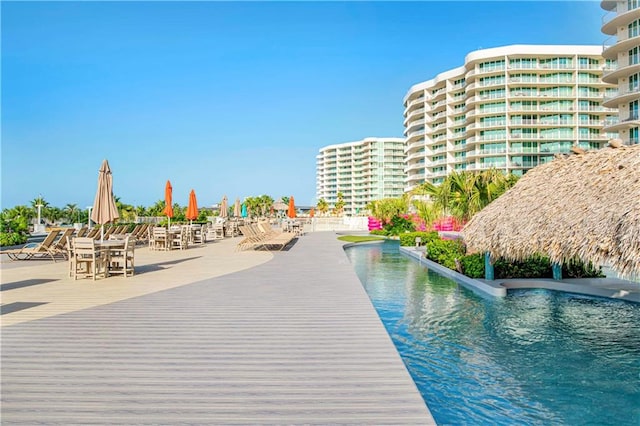 view of swimming pool featuring a water view