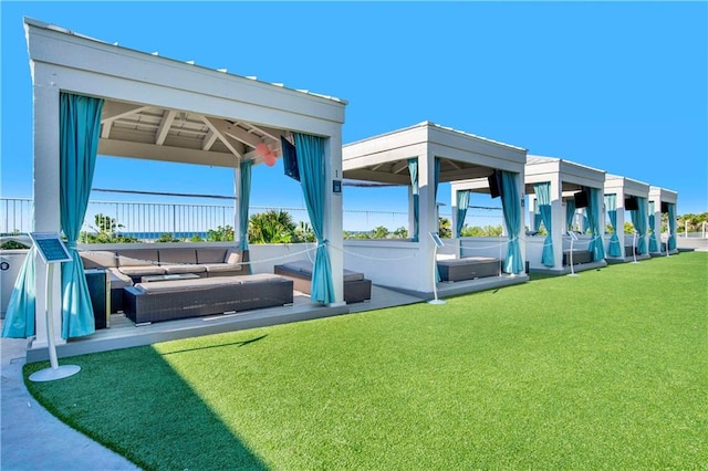 view of home's community with a yard, a gazebo, and an outdoor hangout area